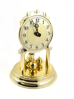 quartz clock showing five to twelfth © atomicrooster