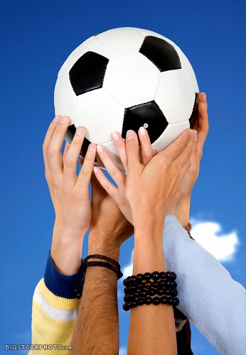 more sporting goods links hands holding a football